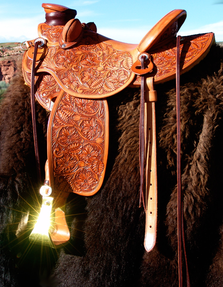 Working Cow Horse / Ranch Cutter by Keith Valley  Buster Welch Ranch Cutter Tree by Swanke Tree Co. 90 degree bars - medium twist Buster Welch Swells - 13&1/2 width 3&3/4 inch metal dally - cutting horn Gullet is 8 inches Height by 6&1/2 width Cantle is 3&1/2 inches high by 12&1/2 inch width and with a 1&1/4 inch dish Seat is finished out at 15&1/2 with a 1&3/4 inch Cheyenne Roll Riggin is stainless steel double D at full setting Semi square skirts Santa Barbara twisted stirrup leathers Your choice of Stirrups Back Billets and Back Cinch All Stainless Steel Hardware Full geometric Border $6500.00
